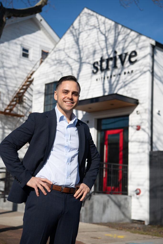 Joseph Colaluca ’09, ’15G outside Strive Kitchen + Bar at 383 Admiral Street, the former home of Club Eagles and Clubbies. It will have three floors of dining, including a basement speakeasy.