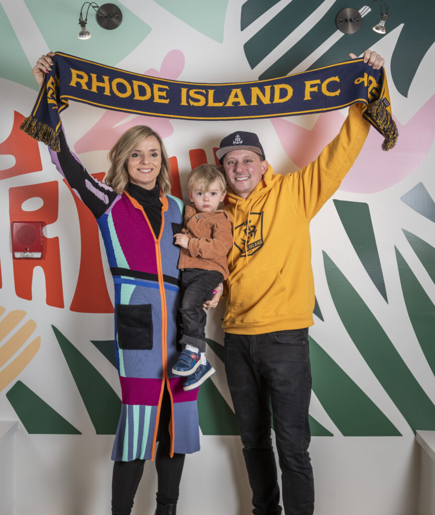 January 27 2023 photoshoot
Myles Dumas and Roisin McGettigan at Nail Communications, Providence displaying gear with the logo that Myles designed for the RI FC