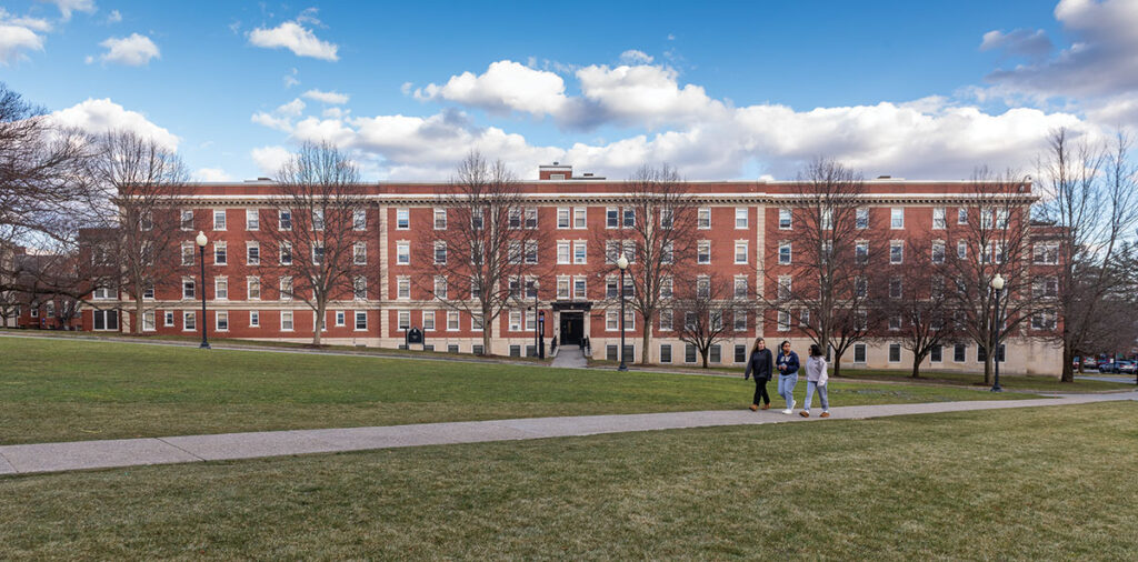 Three students walk past Fennell Hall in January 2023.