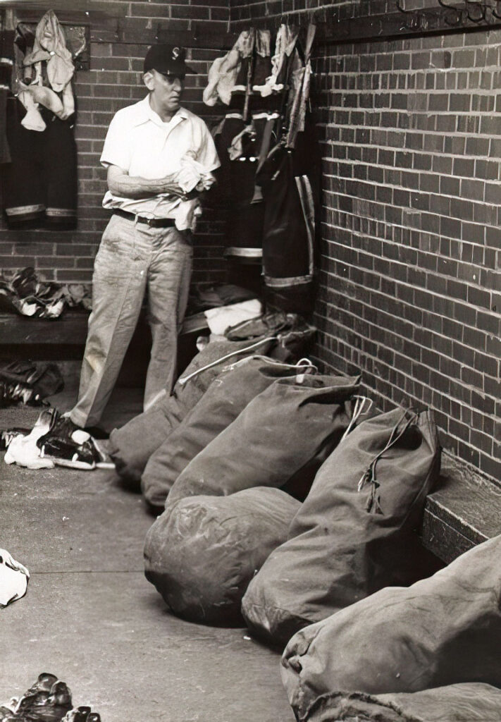 George Army, Rhode Island Reds trainer, with equipment bags.