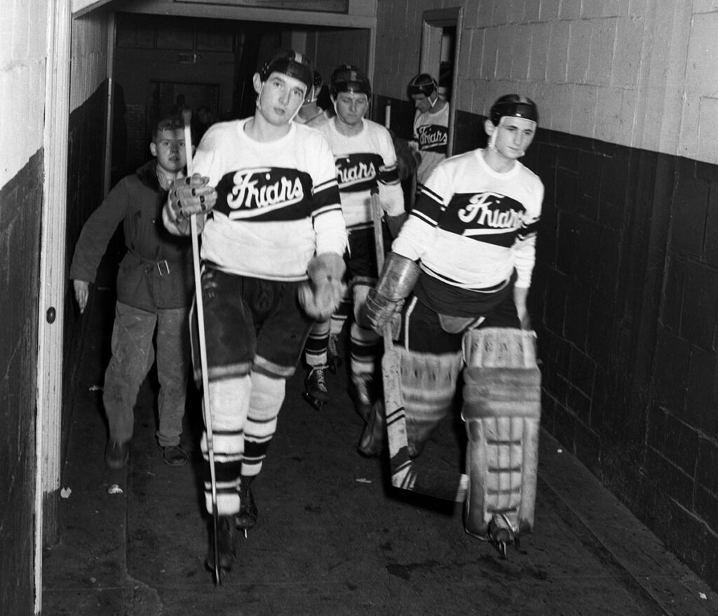 From the 1952-1953 season: Edward Monahan '56, later a member of the PC Athletics Hall of Fame, with goalie Edmund Hornstein '54, who died in Vietnam in 1966.