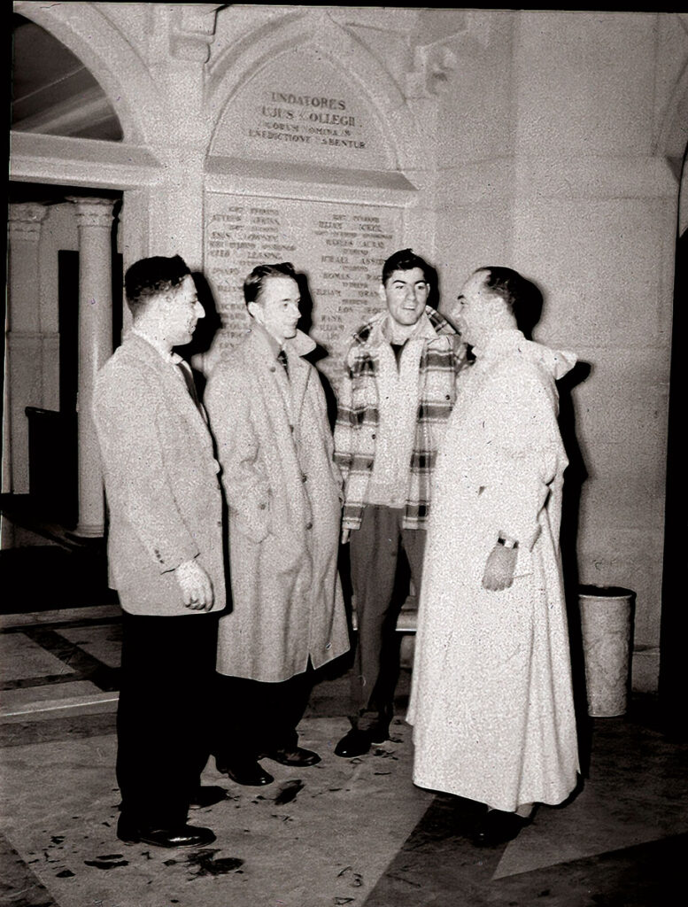 Rev. Herman Schneider, O.P. with students in Harkins Hall. Scheider Arena, which opened in 1973, is named in his honor.