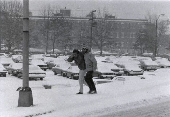 students walking through snow storm