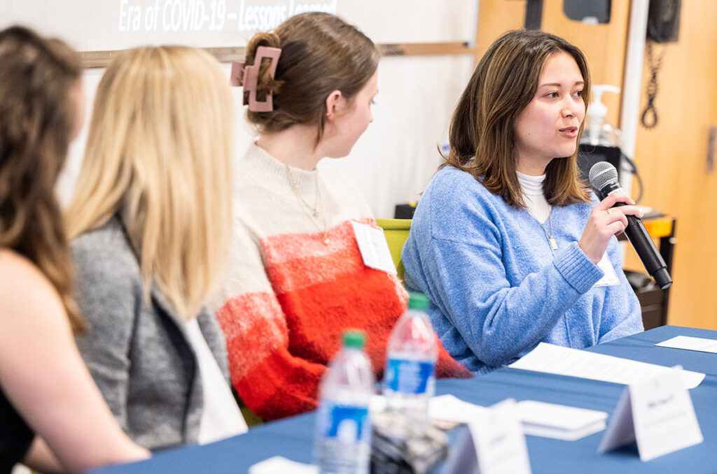 Samantha Gabree '23 asks a question during the annual Anna E. Lavoie Memorial Lecture in March, which featured alumni who work in health journalism.