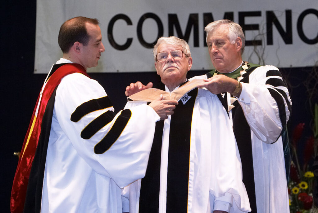 In recognition of his contributions to the Rhode Island community and to baseball, Ben Mondor was awarded an honorary doctor of business administration degree by the college in 2004. College President Rev. Philip A. Smith, O.P. '63 is at right.