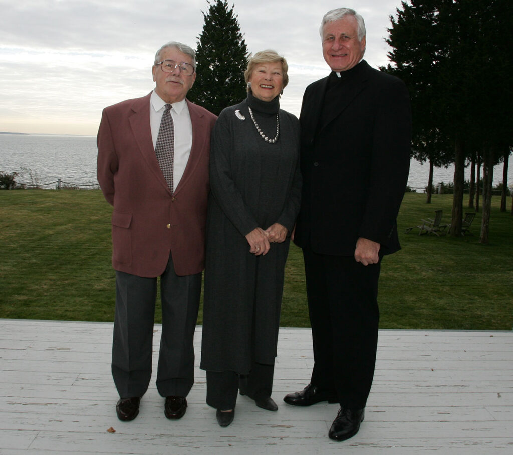 Ben and Madeline Mondor with College President Rev. Philip A. Smith, O.P. '63, at their Warwick Neck home in November 2004. The Mondors donated the home to the college.