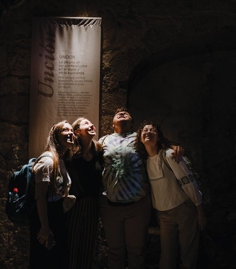 From left: Avery Schaub '25, Liz Varous '25, Michael Gioffre '26, and Sarah Klema '23 in the wings of the cathedral in Palencia, Spain.