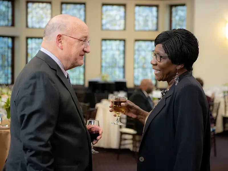 Lena conversing with Dr. Wanda Ingram