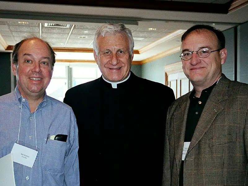 Dr. Lena with William Hudson, Ph.D., professor emeritus of political science, left, and College President Rev. Philip A. Smith, O.P. '63 at 10th anniversary celebration for the Feinstein Institute for Community Service in 2004.