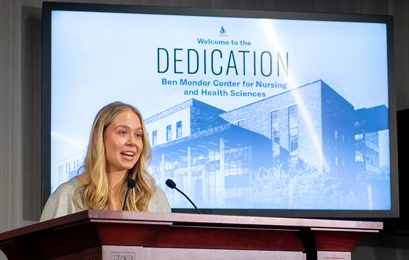 Aria Kriticos '27 presents the student address. She is a member of the first class of nurses at PC.