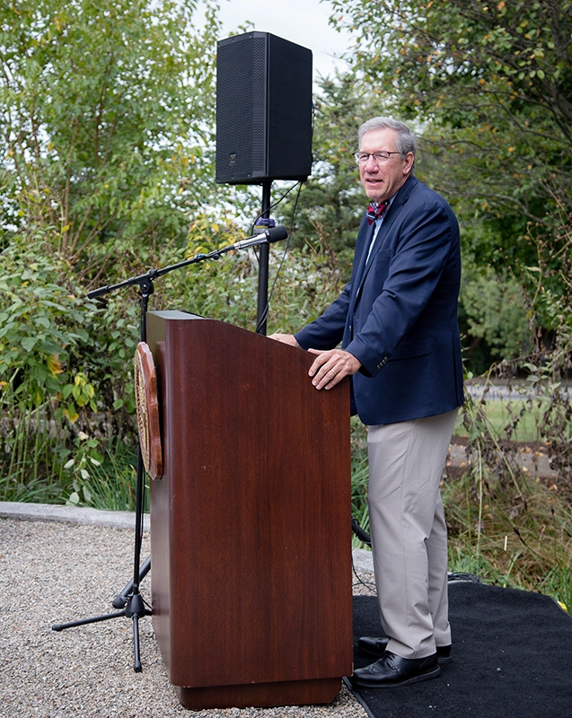 John Breen, chemistry professor, at the podium