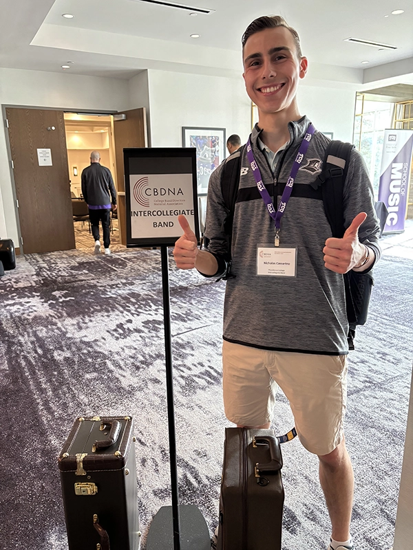 Nick Cassarino '27 gives two thumbs up as he stands in a lobby in Fort Worth, Texas.