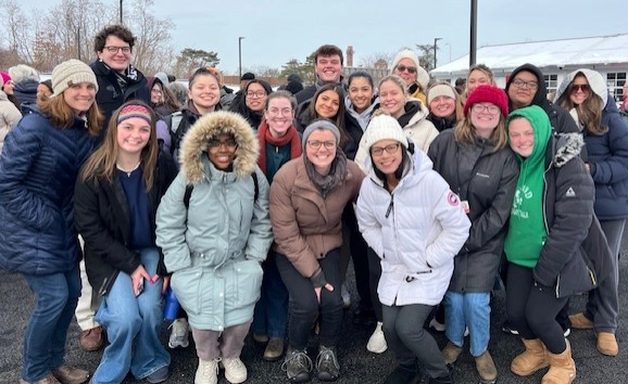Social work students and faculty bundled against the cold at the ECHO Village dedication.
