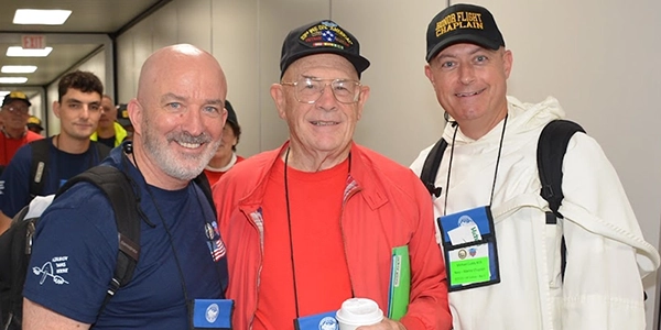 Greg Waldron, veteran Walter Smith '69, and Rev. James Cuddy, O.P. '98.