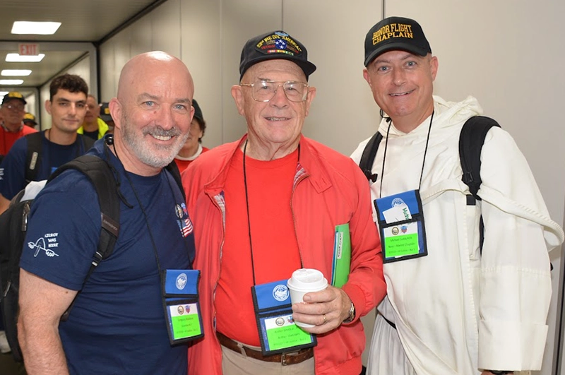Greg Waldron, veteran Walter Smith '69, and Rev. James Cuddy, O.P. '98.