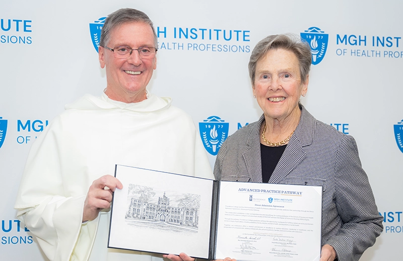 Providence College President Rev. Kenneth R. Sicard, O.P. '78, '82G with Paula Milone-Nuzzo, Ph.D., president of the MGH Institute of Health Professions.