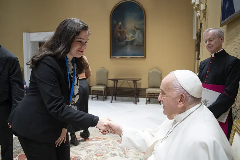 Margaret Price '25 shakes hands with Pope Francis in a meeting at the Vatican in May 2024.