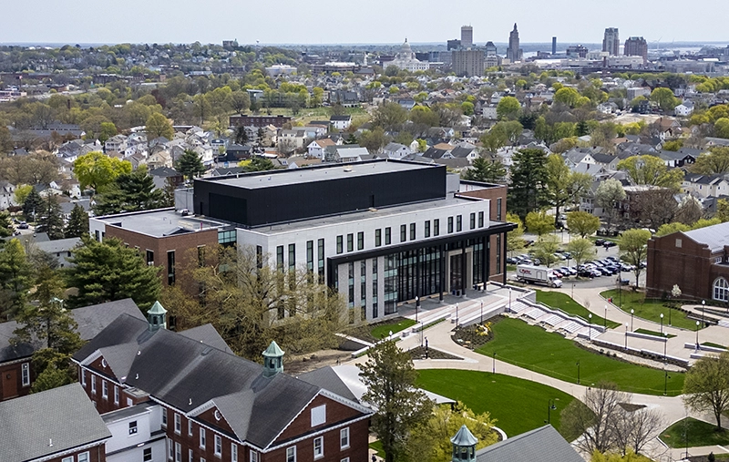 An aerial view of the Ben Mondor Center for Nursing and Health Sciences, which includes the skyline of Providence.