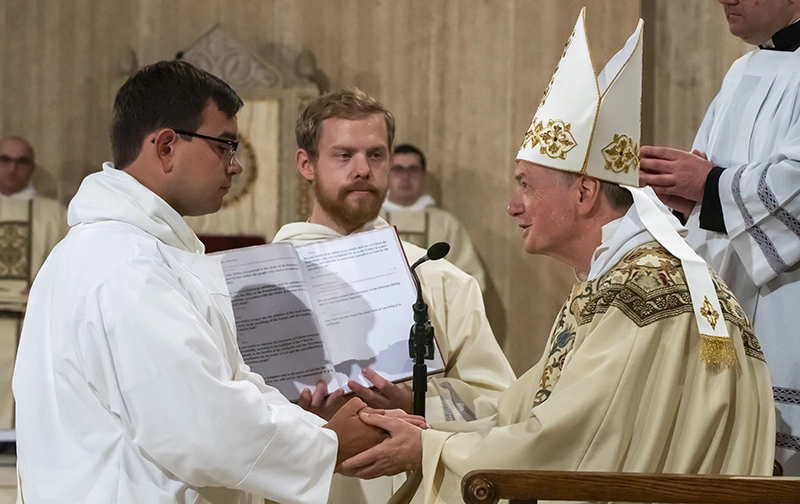 Rev. Nicomedus Thomas, O.P. '18 at his ordination with Archbishop Anthony Fisher, O.P.