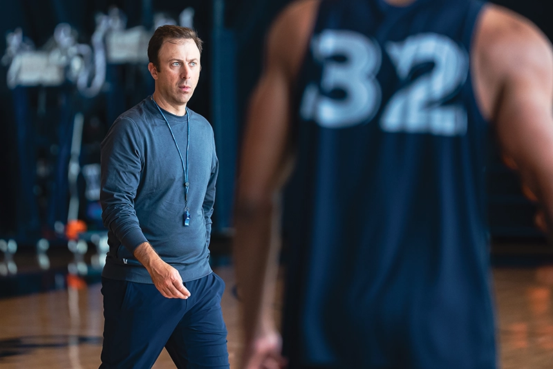 Richard Pitino '05, the new men's basketball coach at Xavier University, looks focused at practice.