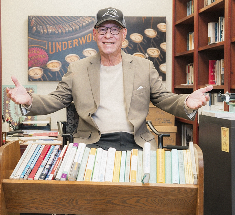 Roy Peter Clark '70, '17Hon. with the 21 books he has written.
