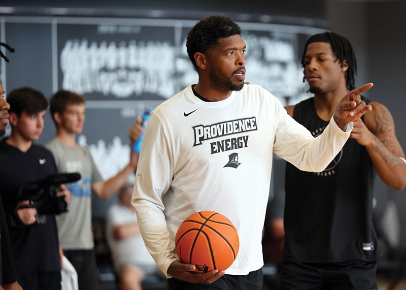 Ryan Gomes '05 leads a summer practice session for the men's basketball team.