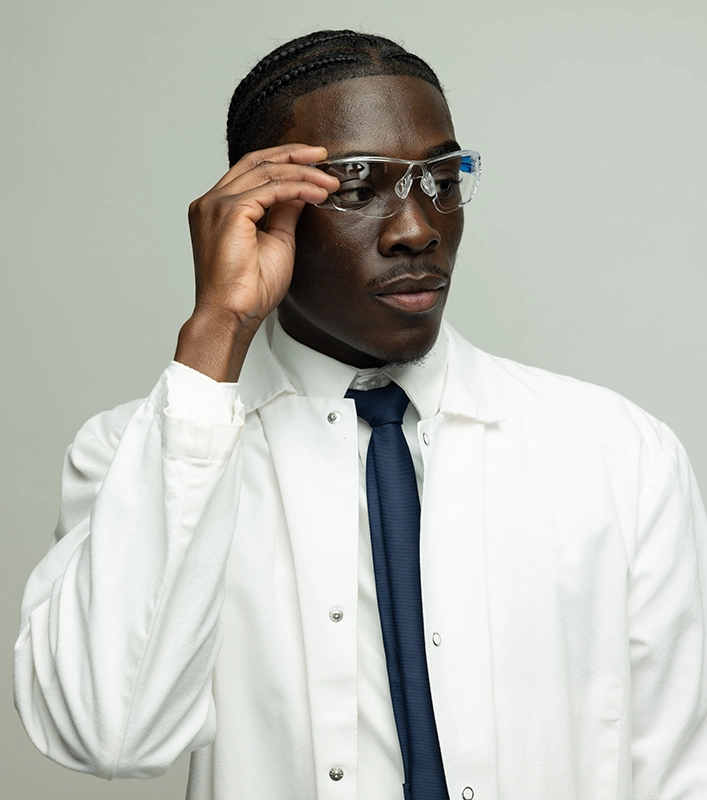 Donald Simpreus '26 wearing eye shields in the lab.