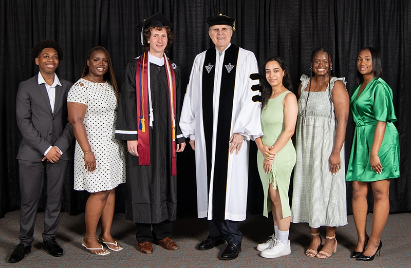 Ron Stride '62, '25Hon. with scholarship recipients. From left, Kareem Bain '28, Jelissa Jonas '27, Rowan McGouran '25, Kelsey Ruiz '18, Linda Ineus '22, and Anastasia Hussett '24.