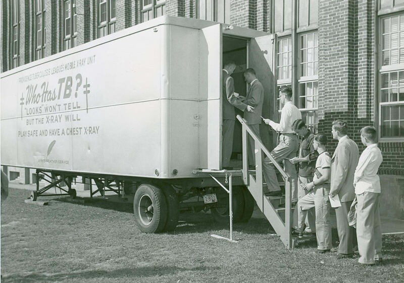 During freshman orientation in 1951, students lined up to be screened for tuberculosis. The image is included in the Mondor mural to show the college's long involvement with healthcare.