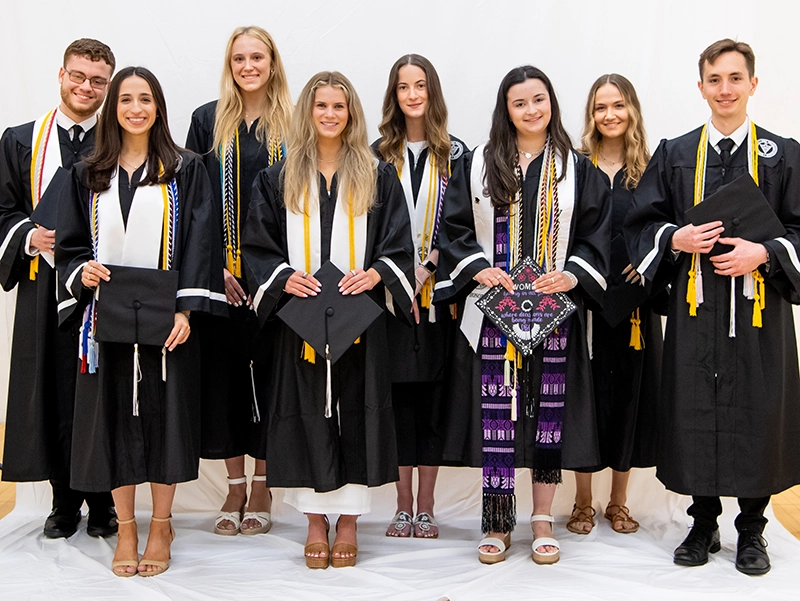 Eight students were tops in the Class of 2025 with 4.0 GPAs. From left, Samuel Seda '25, Angelika Katsagoulis '25, Audrey Koch '25, Hannah Johnson '25, Kate McDonald '25, Christina Charie '25, Claire Cardonnier '25, and Casey Burgess '25.