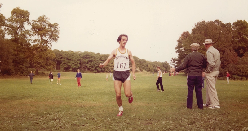 Grassy lawn, men in soft caps, student runners