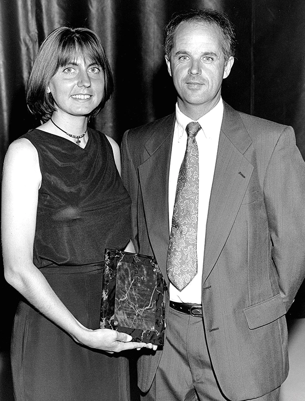 Gladys Ganiel and Ray Treacy with an award
