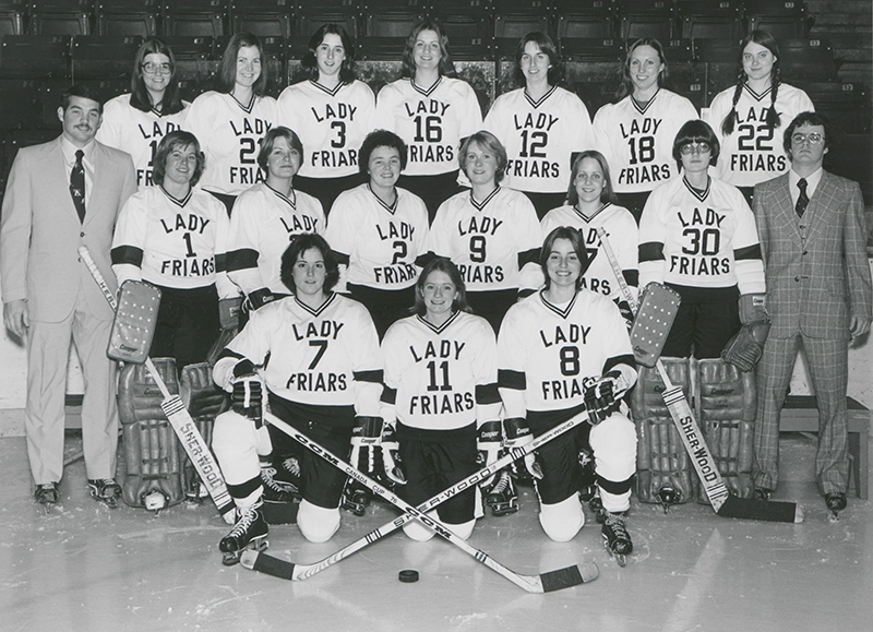 Women's ice hockey players in jerseys that read "Lady Friars."