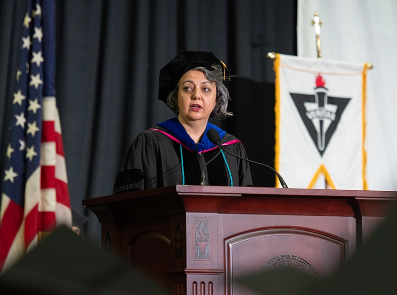 Gizem Zencirci, Ph.D., associate professor of political science and director of the Middle East Studies Program, presents the faculty oration. She is this year’s recipient of the college’s top teaching honor, the Joseph R. Accinno Faculty Teaching Award.