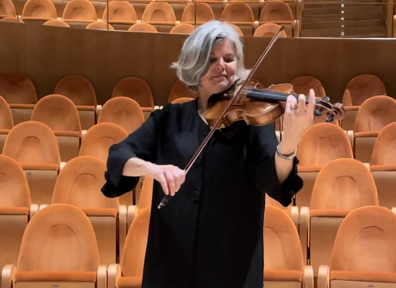 In Cremona, Italy, LIcia Carlson, Ph.D., played her violin in the auditorium at the Museo del Violino. She began playing at age 4.