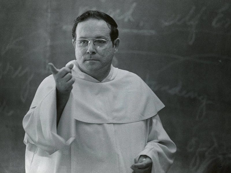 Rev. John Reid, O.P. teaches a theology course in 1977.