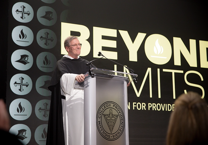 College President Rev. Kenneth R. Sicard, O.P. '78, '82G acknowledges the applause at the Beyond Starts Now campaign launch.