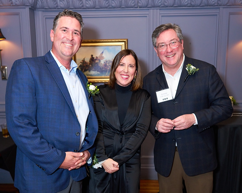 Jeremy Duffy '93, far right, received the Mal Brown Award from the Greater Providence Alumni Club. Bernie Manchester '04 and Liz Oliveira Manchester '02, '16G received the McDonnell Award.