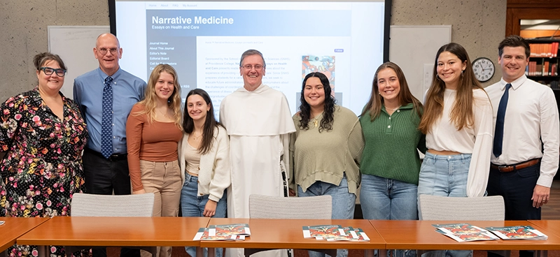At the journal launch, from left, Megan Lessard, head of digital products and metadata at Phillips Memorial Library; Bob Hackey, Ph.D., professor of health sciences; Kate Lindquist ’27; Catie Terminello ’27; College President Rev. Kenneth R. Sicard, O.P. ’78. '82G; Demiana Boutros ’27; Colleen Dorrian ’25; Vanessa Colina ’27; and Will Toner, assistant dean of student academic success and director of peer education in PC’s Writing Center.
