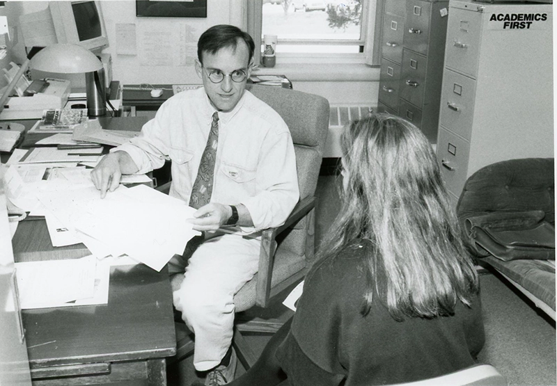 Dr. Lena meets with a student in 1993.