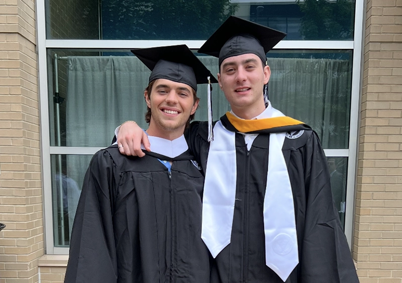 Ryan Ross '24, right, with Brendan McSorley '23 at their high school graduation.