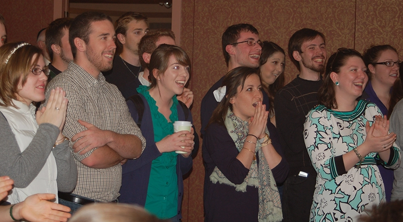 Students in the Campus Ministry Center react to the news that Cardinal Jose Mario Bergoglio of Argentina has been named pope on March 13, 2013.