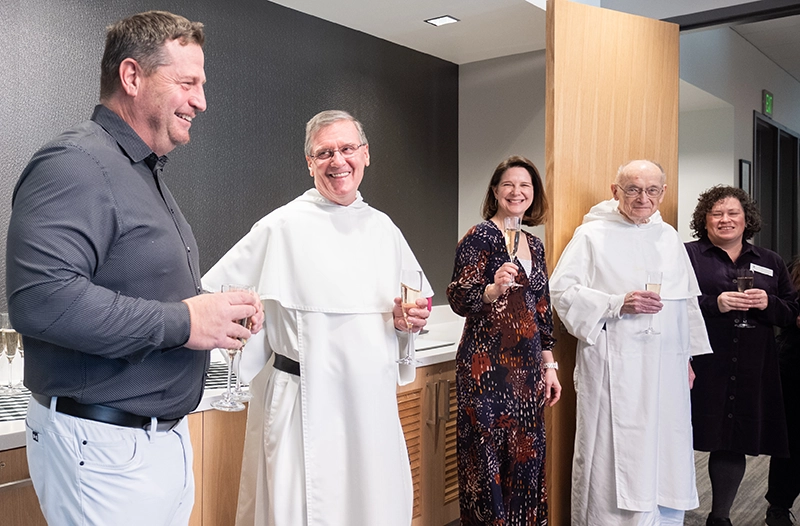 Toasting the completion of the Ben Mondor Center for Nursing and Health Sciences, from left, Kyle McInnis, Sc.D., founding dean of the school; College President Kenneth R. Sicard, O.P. '78, '82G; Nancy Meedzen, DNP, nursing chair; Brother Ignatius Perkins, O.P., who helped develop the nursing curriculum; and Deborah Levine, Ph.D., chair of health sciences.