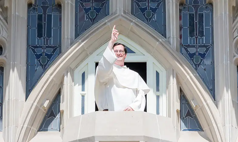 Father Simon blessing from Harkins balcony