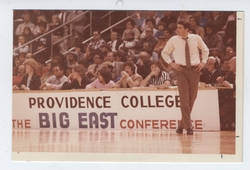 Fans cheering at Men's Basketball game 1980