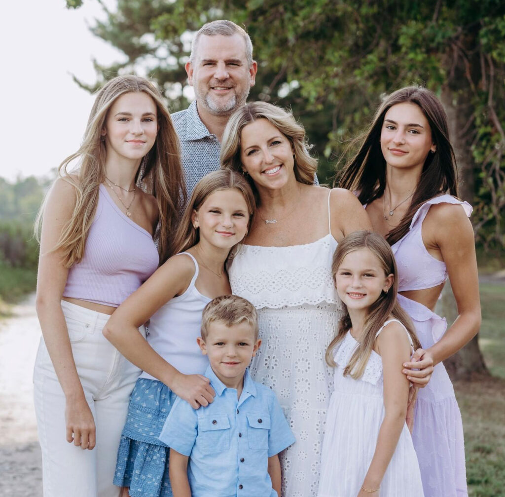 The Cordella family, clockwise from top: Rick Cordella '99, his wife, Jennifer, and their children, Rylie, Quinn, Nathan, Sydney, and Ava.