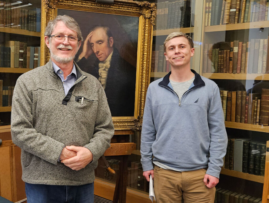 Bruce Graver, Ph.D. welcomes James McGuire '19 to his second Wordsworth Winter Conference.