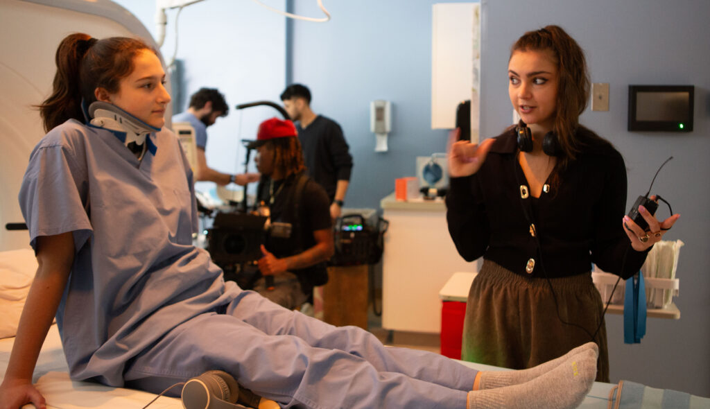 Manya Glassman '19 gives direction to the actor playing her patient during the filming of "How I Learned to Die."