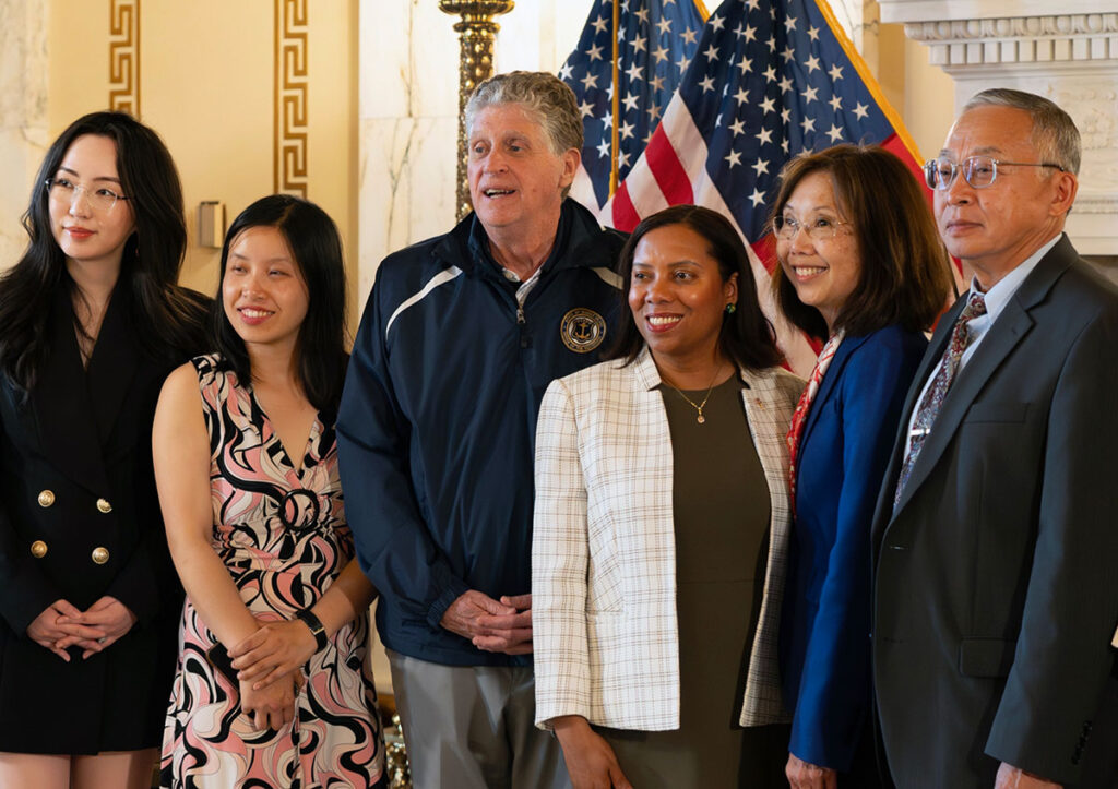 At the AANHPI Heritage Month celebration at the Rhode Island State House, from left, Bing Huang, Senator Victoria Gu, Governor Dan McKee, Lt. Gov. Sabina Matos, Senator Linda Ujifusa, and University of Rhode Island professor Qing (Ken) Yang.