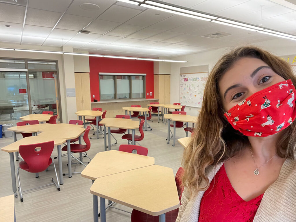 Secondary education major Sarah Downey '24 in a classroom, masked due to the pandemic.